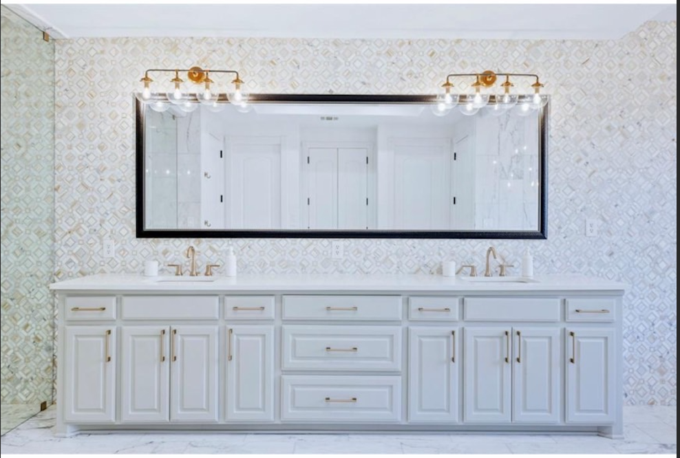 Primary bath double vanity full view with designer tile wall